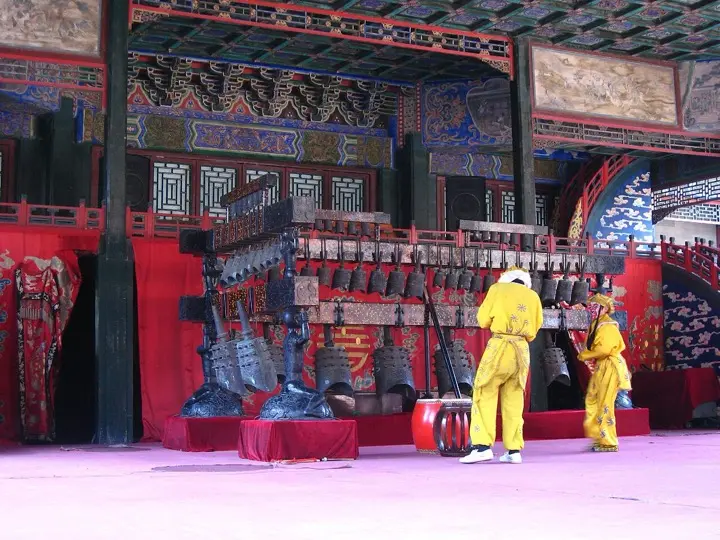 A bianzhong bell ensemble performing in traditional costume